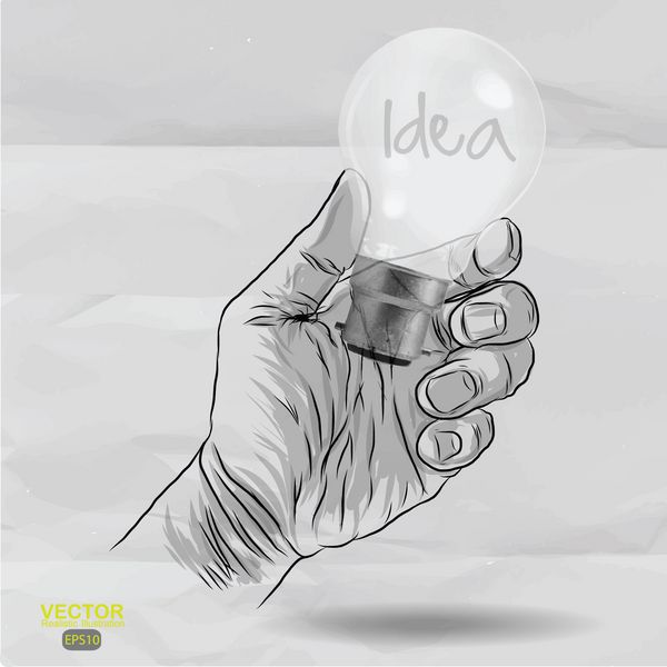 لامپ طراحی شده با دست با کلمه IDEA روی کاغذ مچاله شده به عنوان مفهوم