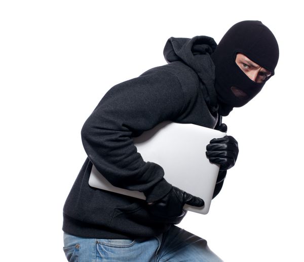 دزد در حال سرقت لپ تاپ