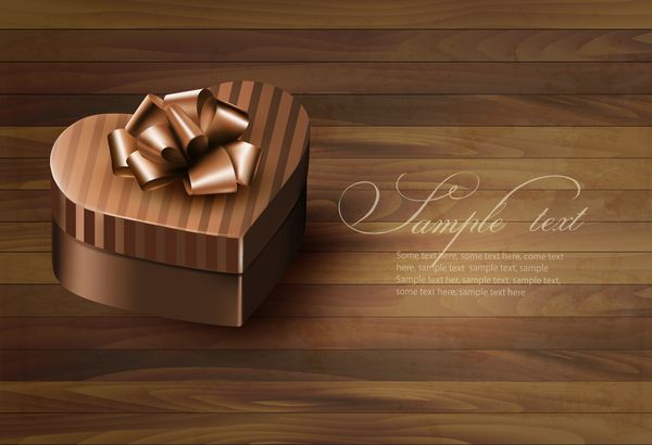 جعبه هدیه به شکل قلب در زمینه چوبی بردار
