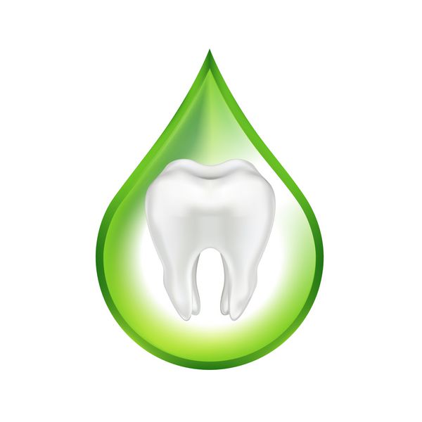 دندان در قطره سبز جدا شده در پس زمینه سفید