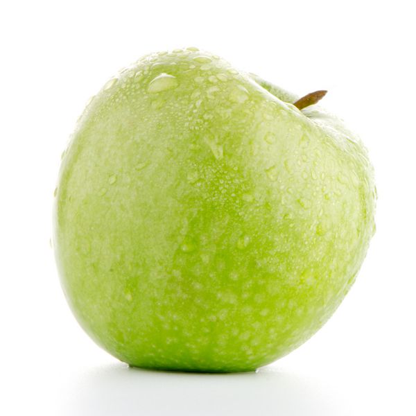 جزئیات نزدیک از سیب سبز در پس زمینه سفید