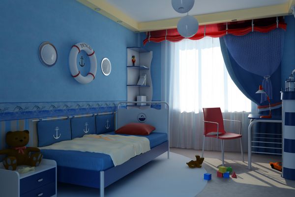 اتاق کودک دنج داخلی که به سبک دریایی با اسباب بازی تزئین شده است