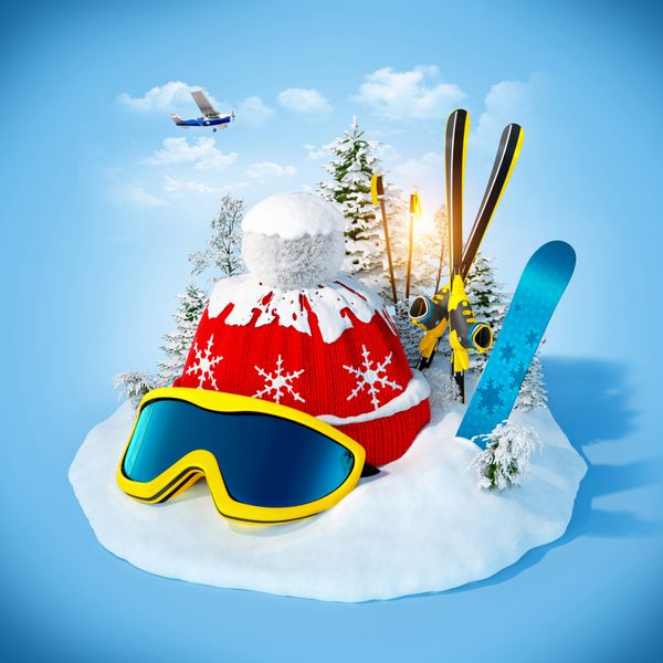 تجهیزات اسکی روی برف در پس زمینه آبی تعطیلات زمستانی