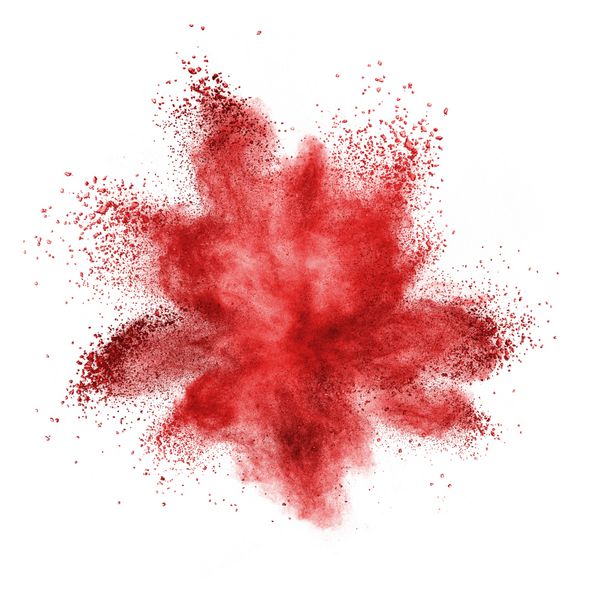 انفجار پودر قرمز جدا شده در پس زمینه سفید