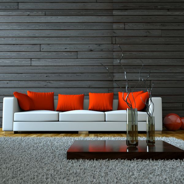 Wohndesign - weisses Sofa mit roten Kissen