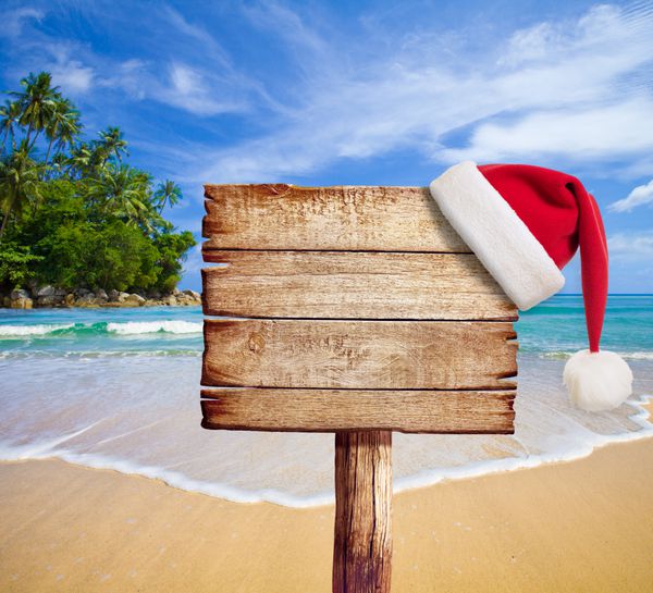 کریسمس در ساحل تابلوی چوبی با کلاه بابا نوئل