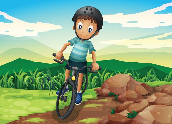 یک بچه دوچرخه سوار در بالای تپه