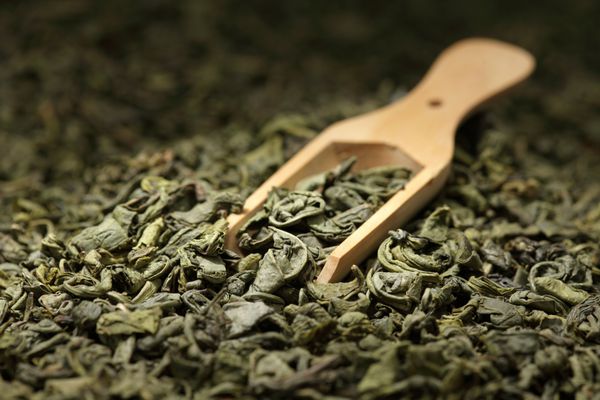 پس زمینه برگ چای اسکوپ چوبی چای سبز