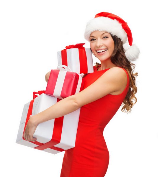 کریسمس کریسمس زمستان مفهوم شادی - زن خندان با کلاه کمکی بابا نوئل با جعبه های هدیه فراوان