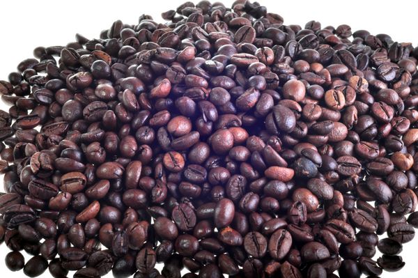 نمای نزدیک از پس زمینه دانه های قهوه