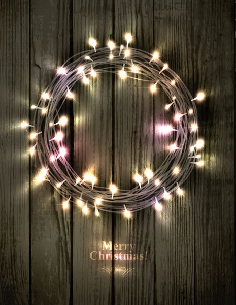 تاج گل کریسمس درخشان ساخته شده از چراغ های LED روی پس زمینه چوبی