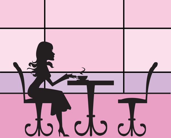 یک دختر زیبا که در یک کافه نشسته است