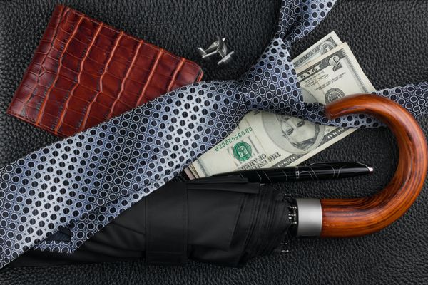کراوات چتر خودکار کیف پول دکمه سرآستین پول روی پوست می تواند به عنوان پس زمینه استفاده شود