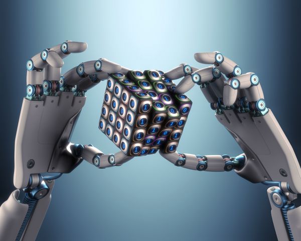 دست روباتی که مفهوم مکعب دوتایی پردازش منطقی را در دست دارد مسیر برش گنجانده شده است