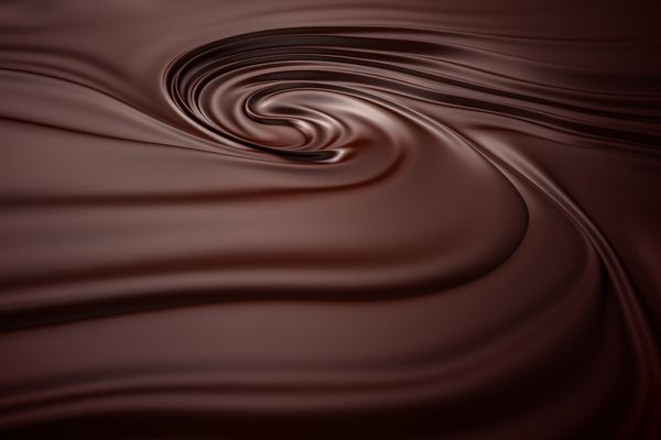 پس زمینه چرخش شکلاتی توده شکلات ذوب شده تمیز و دقیق