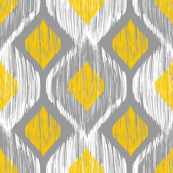 الگوی ایکات بدون درز در رنگ های زرد و خاکستری وکتور پس زمینه قبیله ای