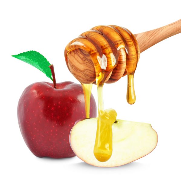 چکیدن سیب و عسل جدا شده روی سفید