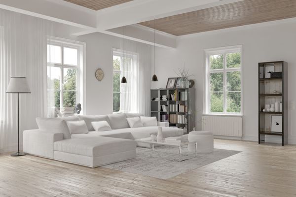 فضای داخلی اتاق نشیمن مدرن شیروانی با دکوراسیون سفید تک رنگ یک سوئیت استراحت مدولار راحت و قفسه‌های کتاب فرش و برجسته با تیرهای سقفی ساختاری رندر سه بعدی