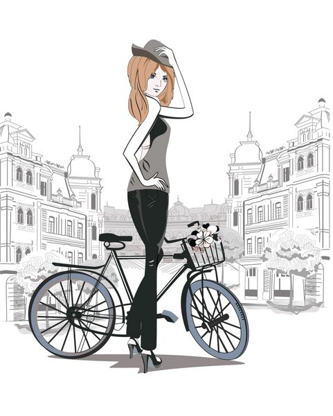 دختر مد با کلاه روی دوچرخه در خیابان های شهر قدیمی