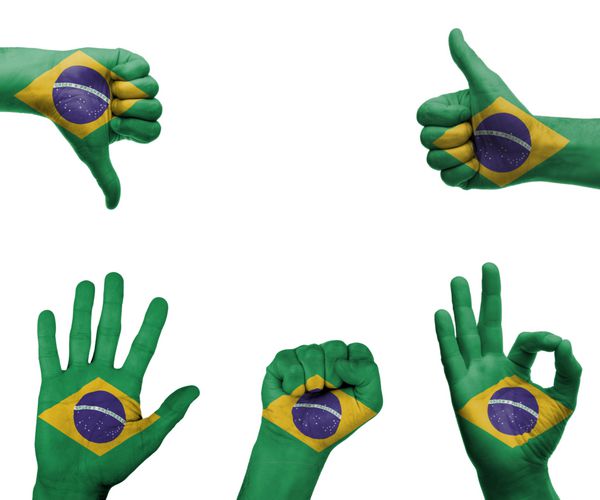 مجموعه ای از دست ها با ژست های مختلف که در پرچم برزیل پیچیده شده اند