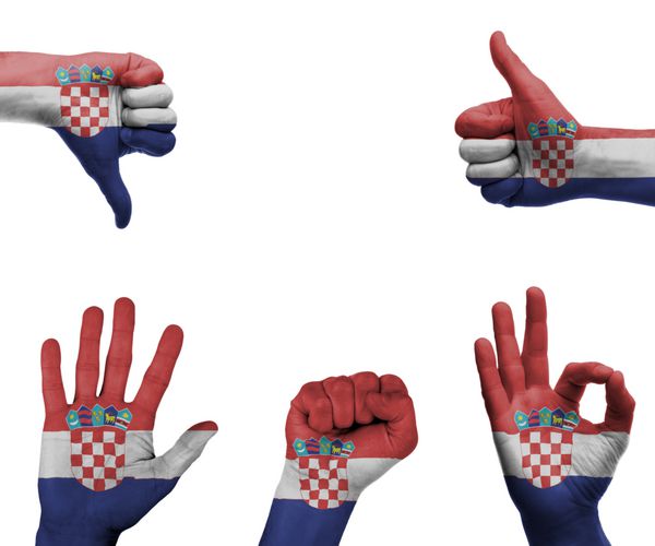 مجموعه ای از دست ها با ژست های مختلف در پرچم کرواسی پیچیده شده است