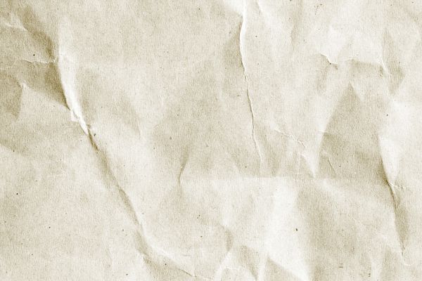پس‌زمینه بافت الگوی کاغذ رنگی خامه‌ای کلاسیک قدیمی در رنگ قهوه‌ای سبز روشن درخشانمفهوم پس‌زمینه صاف ساده چین‌خورده کاغذ دیواری ژولیده گرانج دیوار کاغذ پوستی لبه خالی
