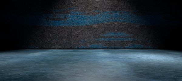 fondo abstracto suelo de cemento y pared de la calle en la oscuridad هورمیگون