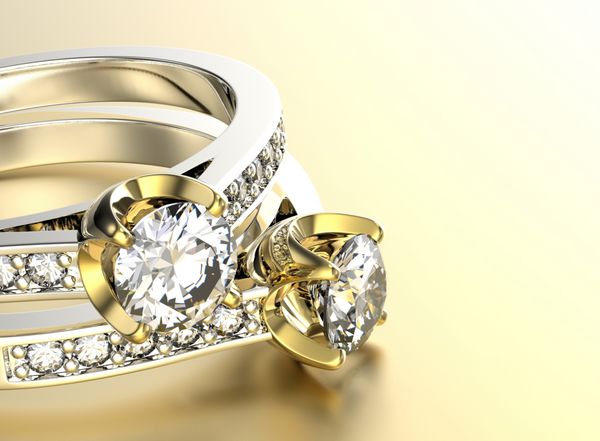 حلقه نامزدی طلایی با الماس پس زمینه جواهرات