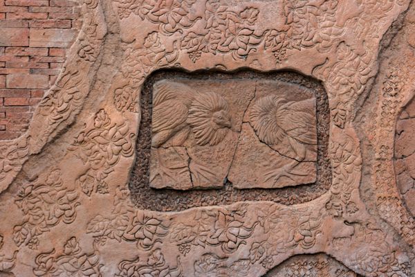 حکاکی سنگ فرهنگ بالی روی دیوار معبد