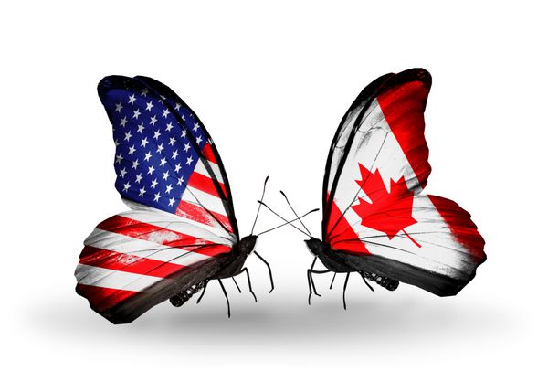 دو پروانه با پرچم ایالات متحده آمریکا و کانادا