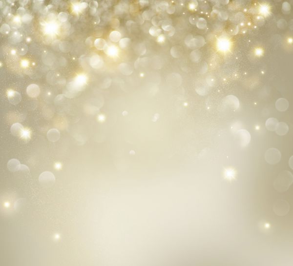 پس زمینه کریسمس پس زمینه زرق و برق انتزاعی طلایی تعطیلات بدون فوکوس با ستاره های چشمک زن بوکه تار