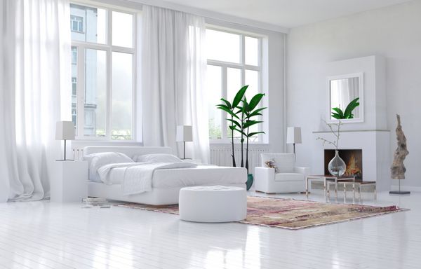 فضای داخلی اتاق خواب سفید و جادار معاصر با دکوراسیون تک رنگ و تخت و صندلی راحتی در زیر پنجره های بزرگ با دید آفتابگیر رندر سه بعدی