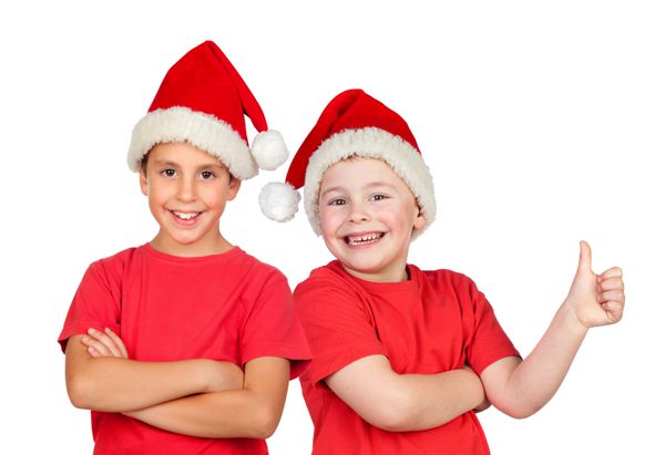 دو کودک با کلاه کریسمس