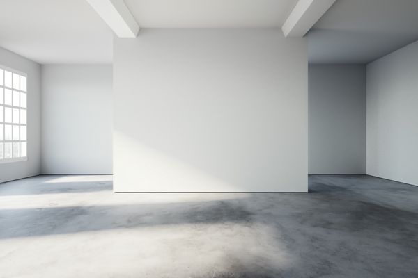 فضای داخلی ساده به سبک شیروانی با کف بتنی و دیوارهای سفید رندر سه بعدی