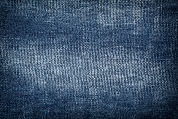 پارچه - سری پارچه شلوار جین آبی نمای نزدیک از جزئیات یک پس زمینه پارچه شلوار جین