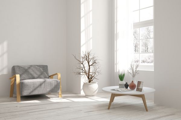 اتاق سفید با صندلی راحتی و منظره زمستانی در پنجره طراحی داخلی اسکاندیناوی تصویر سه بعدی
