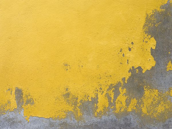 پس زمینه دیوار رنگ شده زرد قدیمی