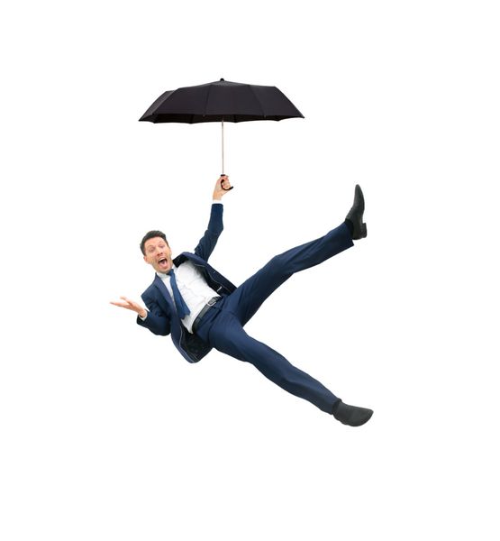 تصویر تاجری که چتر در دست دارد و روی پس‌زمینه سفید پرواز می‌کند