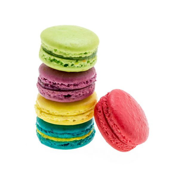 Colorful macarons on white background. Macaron or Macaroon is sweet meringue-based confection.
