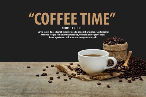 Hot Coffee cup with coffee beans on the wooden table and the black background with copy space for your text