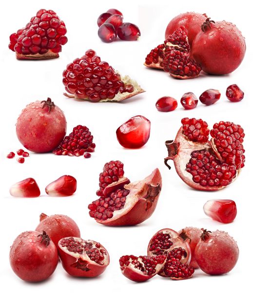 مجموعه ای از میوه های انار قرمز جدا شده بر روی زمینه سفید