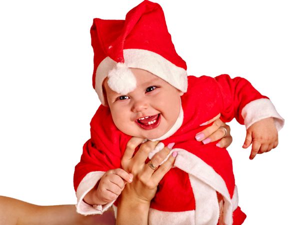 لباس بچه بچه برای کلاه سانتا نگه داشتن توپ کریسمس