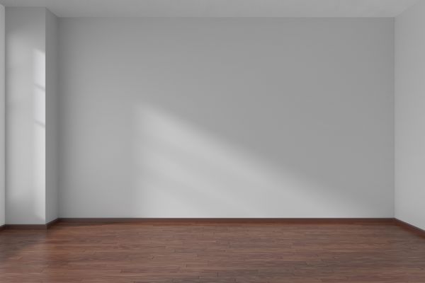 اتاق خالی با دیوارهای صاف سفید و مسطح و کف پارکت چوبی تیره تحت نور خورشید از طریق پنجره تصویر 3D