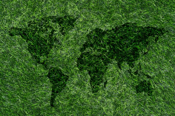 مفهوم روز زمین نقشه جهان در چمن سبز