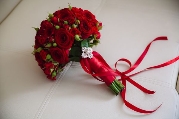 Wedding bouquet with red roses Bride