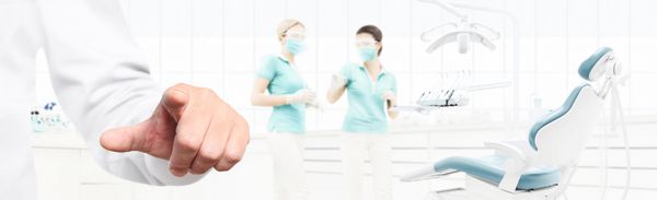 dentist hand touch screen on dental clinic with dentist
