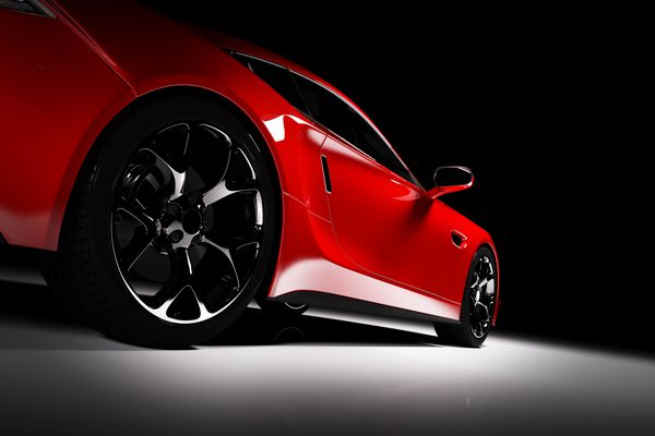 ماشین اسپرت قرمز مدرن در کانون توجه در پس زمینه سیاه نمای جلویی رندر سه بعدی خودروهای مجلل
