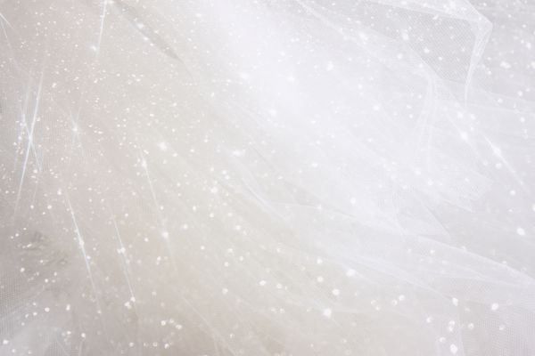 پس زمینه بافت نوعی پارچه ابریشمی طرح دار با روکش براق مفهوم عروسی
