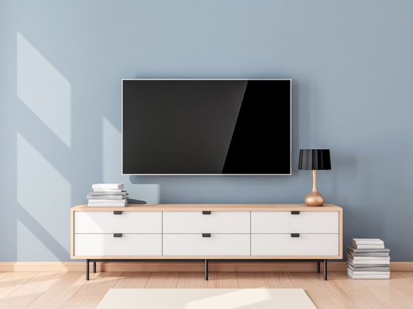 Smart TV Mockup با صفحه خالی که در اتاق نشیمن مدرن به دیوار آویزان شده است رندر سه بعدی