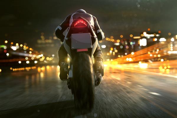 موتور سیکلت در شهر شبانه حرکت می کند
